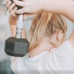 woman lifting weights with discounts gym membership