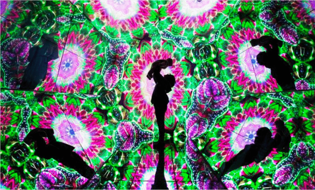 woman with child in kaleidoscope light display at Imaginarium